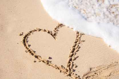 beige sand with heart engrave